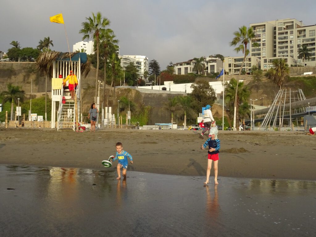 Playing with sand in the beach, Lima