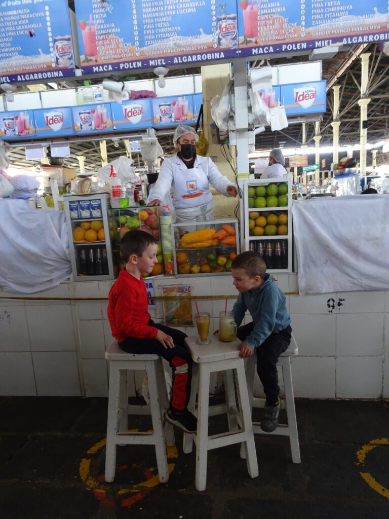 Drinking fresh juices in the Cusco market