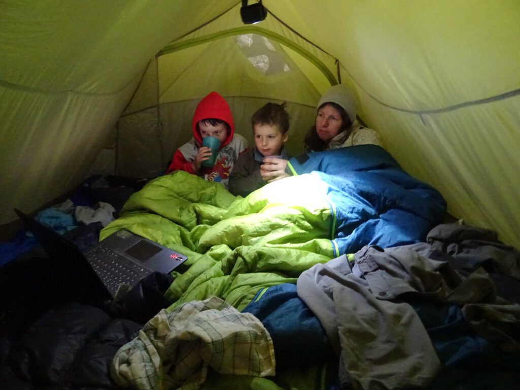 Watching a film inside the tent